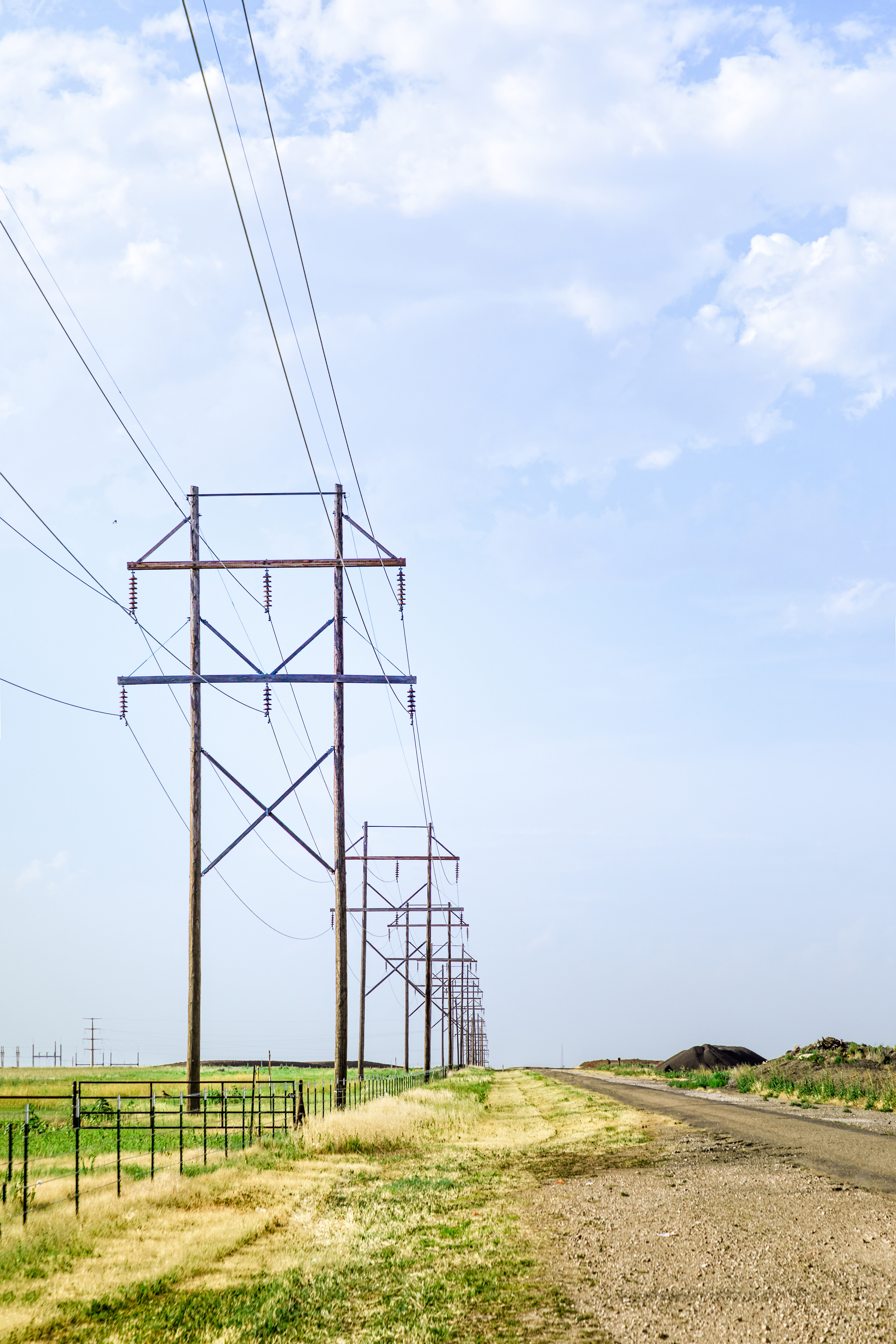 Telephone poles support power lines, credit: Freepik