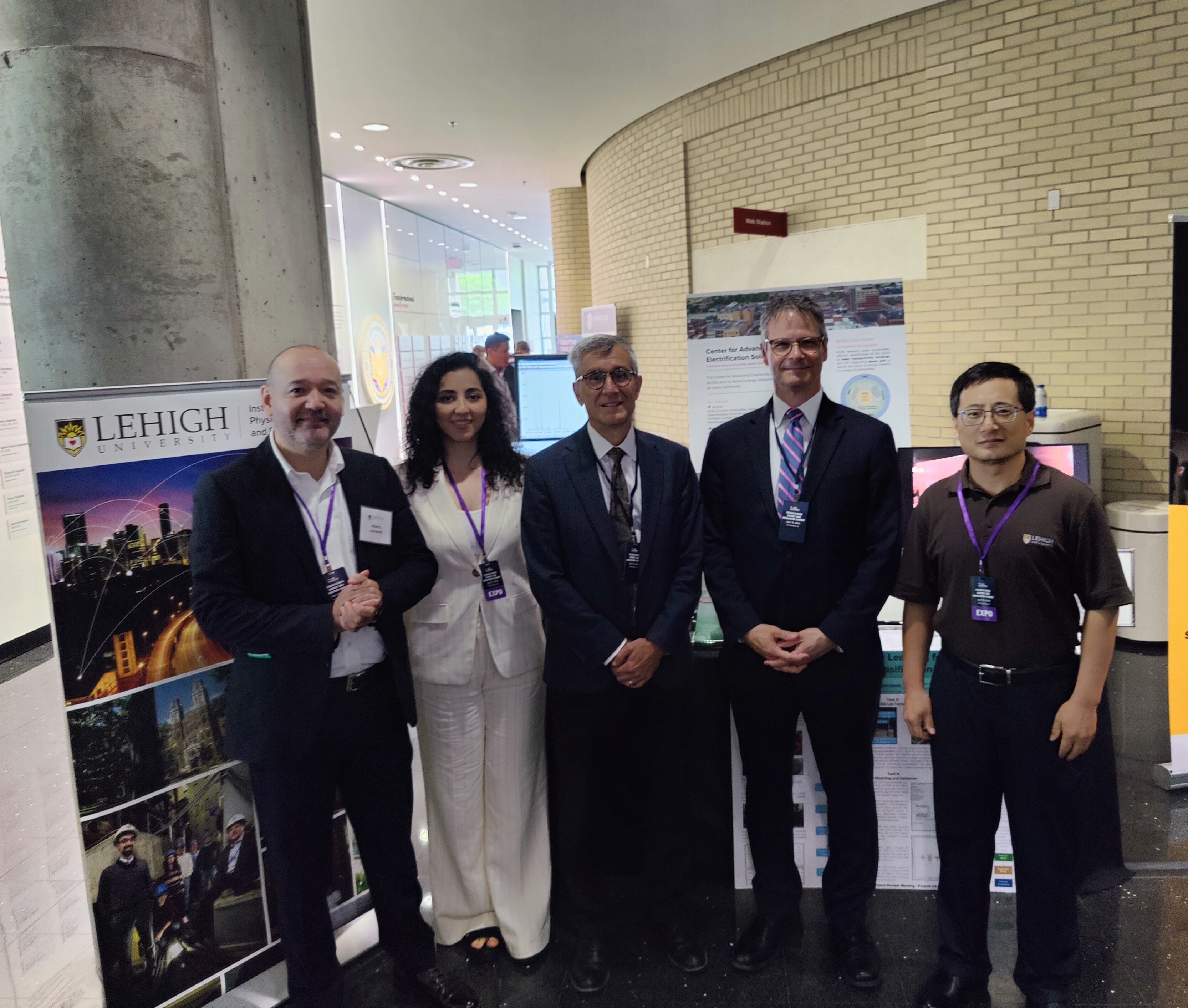 Lehigh researchers pose at their expo booth