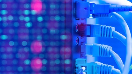 Closeup of ports, wires, and lights on a computer server